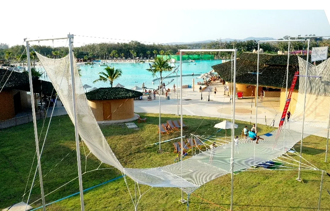 Full-size flying trapeze rig installed at a water park — Bluetree Phuket, Thailand — MACA flying trapeze rig