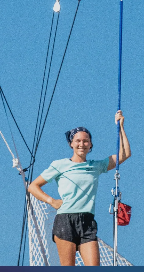 Coach on the double-wide pedestal board of a flying trapeze rig — MACA academy, Phuket — MACA flying trapeze rig