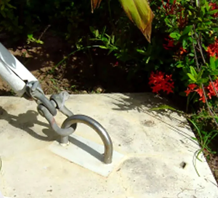 Stainless steel structural anchor installed in concrete at a tropical site — MACA flying trapeze rig